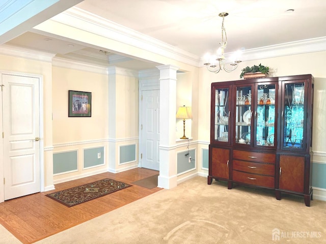 2109 Conrad Way, Franklin, NJ 08873 - carpeted entrance foyer with crown molding, a chandelier, decorative columns, and wood finished floors