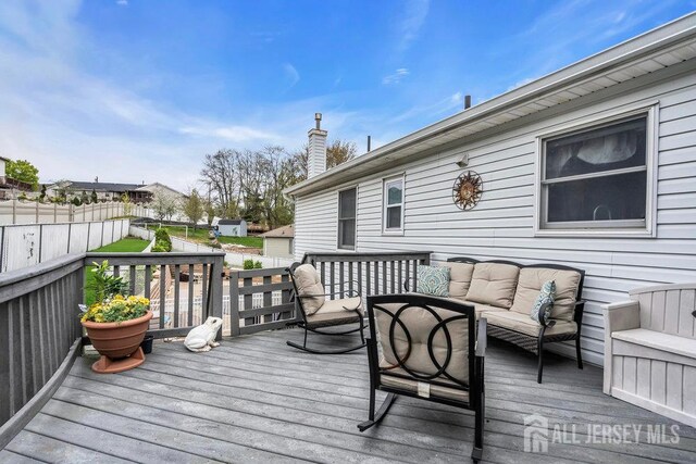 6 Muravski Ct, South River, NJ 08882 - wooden terrace featuring an outdoor hangout area
