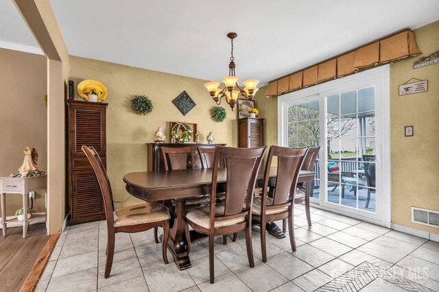 6 Muravski Ct, South River, NJ 08882 - dining area with a chandelier and baseboards