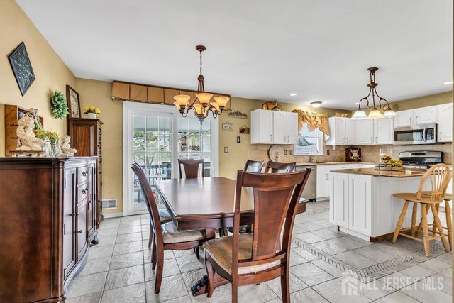 6 Muravski Ct, South River, NJ 08882 - dining space with a chandelier and recessed lighting