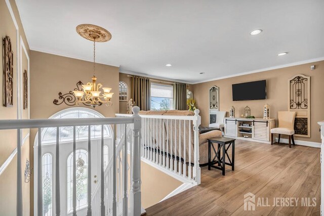 6 Muravski Ct, South River, NJ 08882 - living room featuring a chandelier, light wood-type flooring, crown molding, and recessed lighting