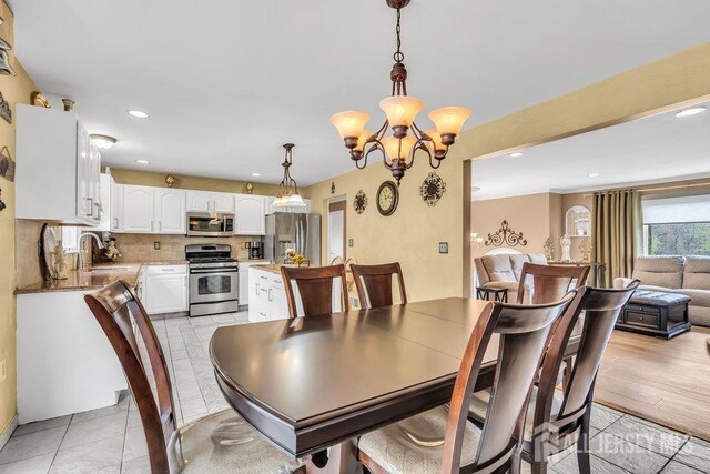 6 Muravski Ct, South River, NJ 08882 - dining area with a chandelier and recessed lighting