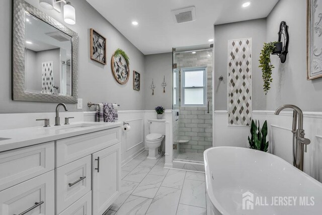 6 Muravski Ct, South River, NJ 08882 - full bathroom with marble look tile flooring, vanity, wainscoting, a stall shower, and a freestanding bath