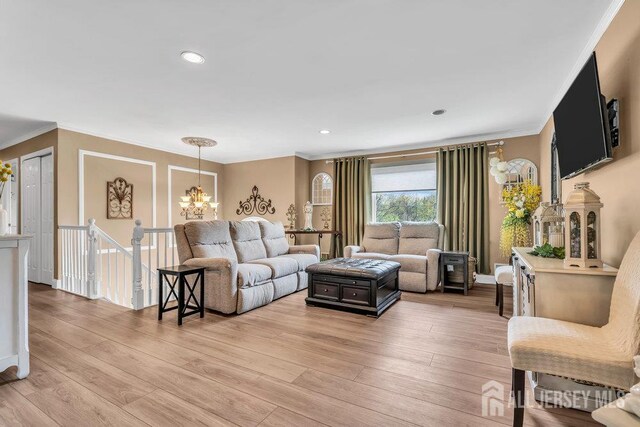 6 Muravski Ct, South River, NJ 08882 - living room featuring crown molding, a chandelier, light wood-style floors, and recessed lighting
