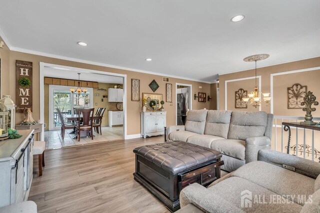 6 Muravski Ct, South River, NJ 08882 - living room with a chandelier, ornamental molding, light wood finished floors, and recessed lighting
