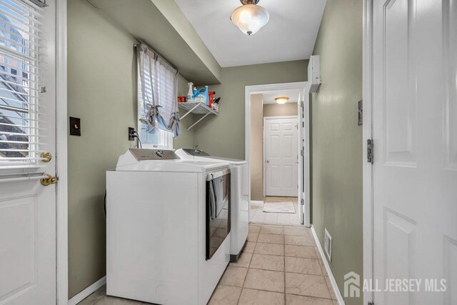 6 Muravski Ct, South River, NJ 08882 - laundry area featuring washer and clothes dryer and light tile patterned floors