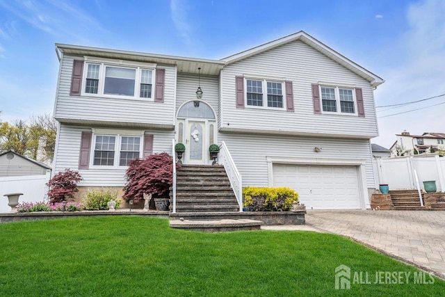 6 Muravski Ct, South River, NJ 08882 - bi-level home featuring a garage and decorative driveway