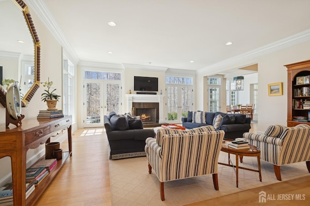 56 Cradle Rock Rd, Princeton, NJ 08540 - living room with ornamental molding, a lit fireplace, light wood finished floors, plenty of natural light, and recessed lighting