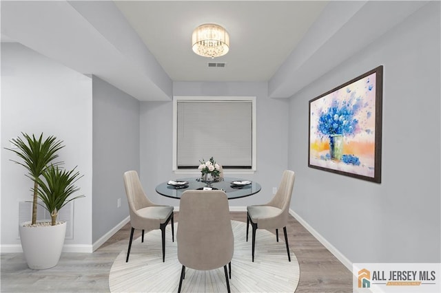 dining area with light hardwood / wood-style flooring