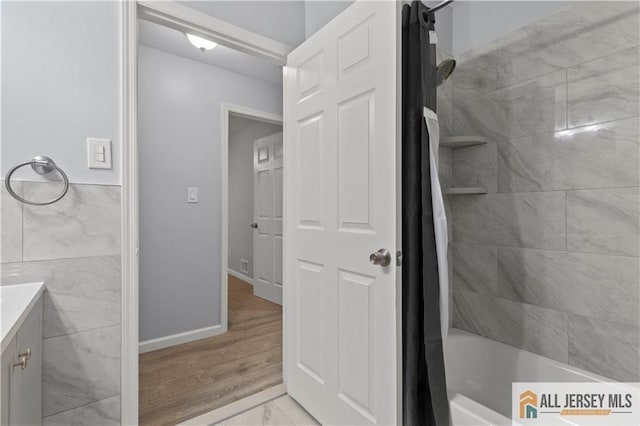 bathroom featuring vanity and shower / tub combo