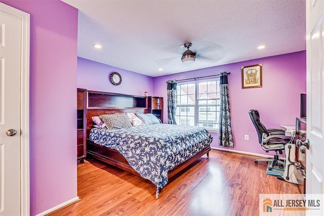 32 Prestwick Way Unit 32, Edison, NJ 08820 - bedroom with a textured ceiling, wood finished floors, a desk, a ceiling fan, and recessed lighting