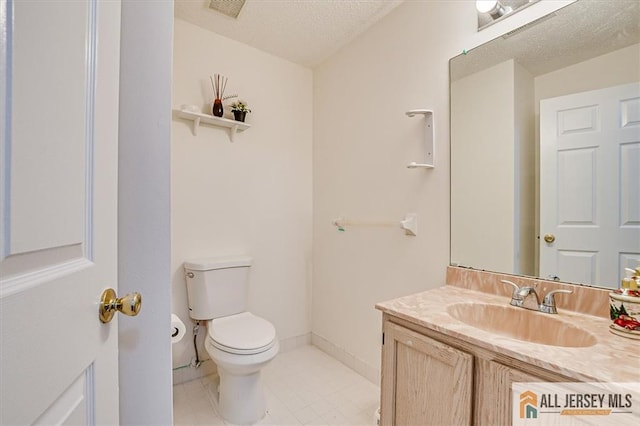 32 Prestwick Way Unit 32, Edison, NJ 08820 - half bath featuring vanity, tile patterned flooring, and a textured ceiling