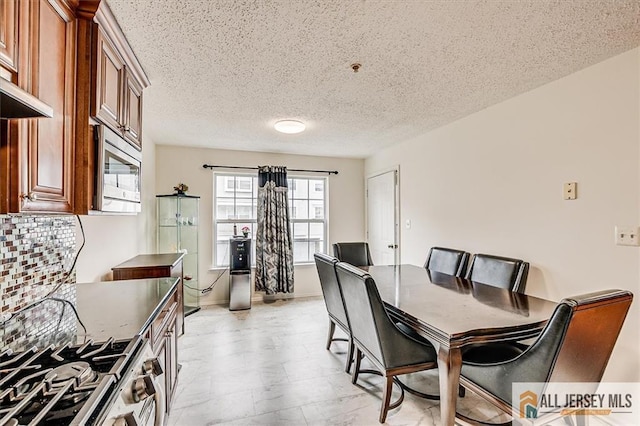 32 Prestwick Way Unit 32, Edison, NJ 08820 - dining room featuring a textured ceiling