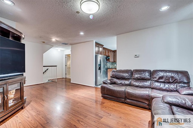 32 Prestwick Way Unit 32, Edison, NJ 08820 - living area featuring a textured ceiling, wood finished floors, and recessed lighting