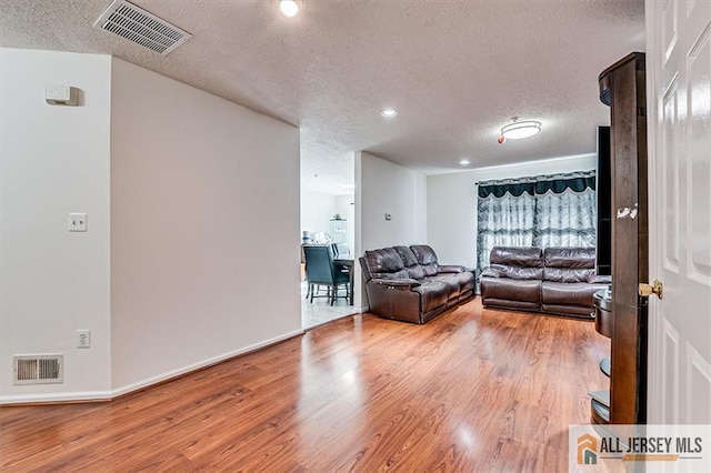 32 Prestwick Way Unit 32, Edison, NJ 08820 - living area featuring a textured ceiling, light wood-style floors, and recessed lighting