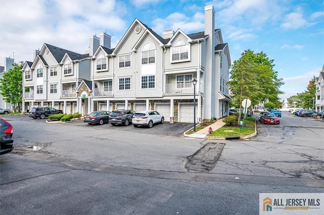 32 Prestwick Way Unit 32, Edison, NJ 08820 - view of property with uncovered parking and a residential view