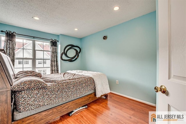32 Prestwick Way Unit 32, Edison, NJ 08820 - bedroom featuring a textured ceiling, wood finished floors, and recessed lighting