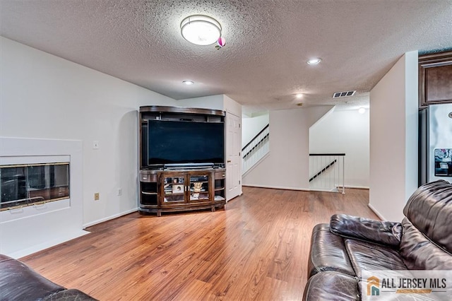 32 Prestwick Way Unit 32, Edison, NJ 08820 - living room with wood finished floors, a textured ceiling, and recessed lighting