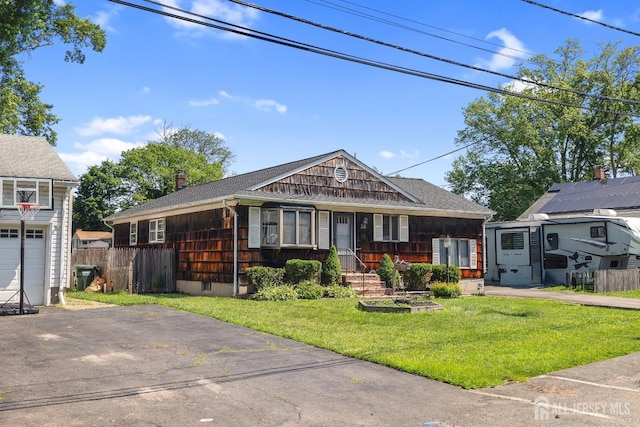 28 Lehigh St, Dunellen, NJ 08812 - view of front of property featuring roof with shingles and a chimney