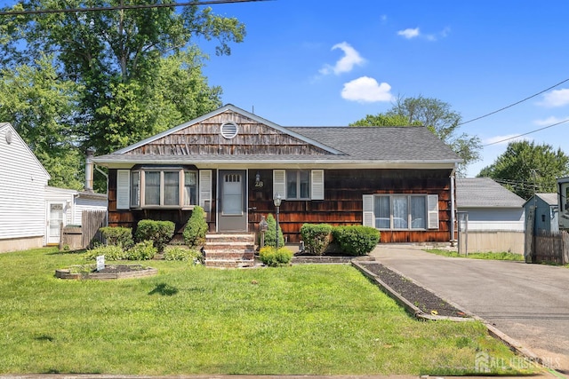 28 Lehigh St, Dunellen, NJ 08812 - view of front of house featuring a shingled roof and a porch