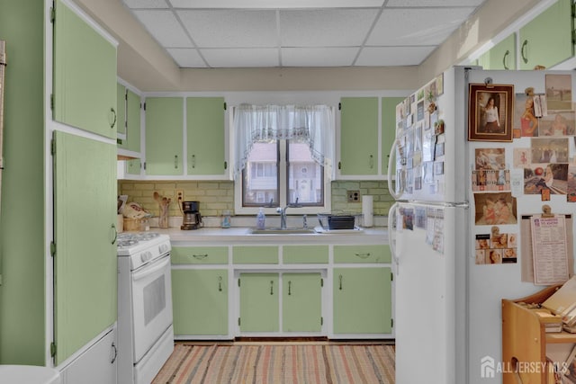 28 Lehigh St, Dunellen, NJ 08812 - kitchen with white appliances, a drop ceiling, light countertops, decorative backsplash, and green cabinetry