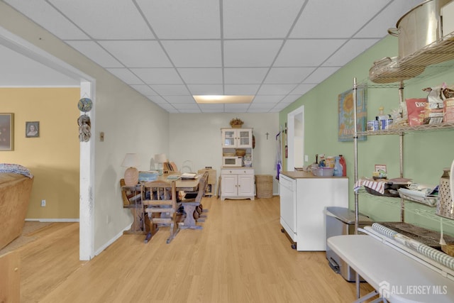 28 Lehigh St, Dunellen, NJ 08812 - dining area with light wood-type flooring and a drop ceiling