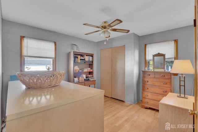 28 Lehigh St, Dunellen, NJ 08812 - bedroom featuring light wood-style flooring, a closet, a desk, and ceiling fan