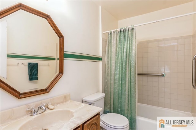 323 Gills Ln Unit 9C, Iselin, NJ 08830 - full bathroom featuring toilet, vanity, and shower / tub combo with curtain