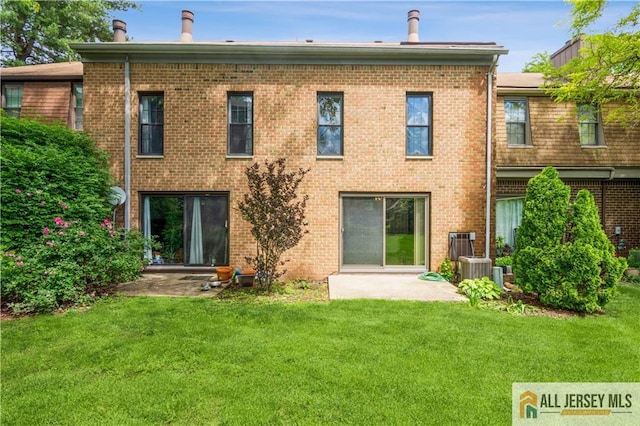 323 Gills Ln Unit 9C, Iselin, NJ 08830 - back of house with a yard, brick siding, and a patio