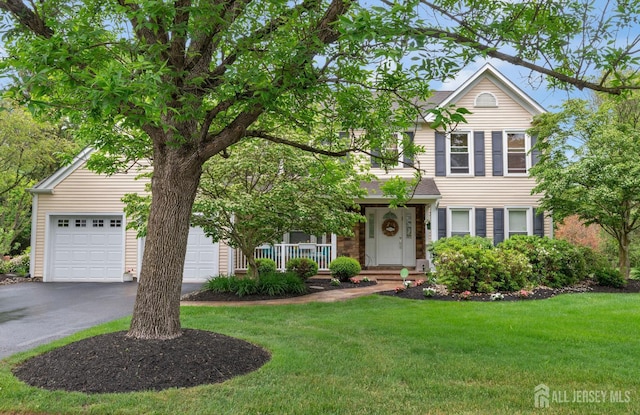 6 Drayton Land, Plainsboro, NJ 08536 - view of front facade featuring a front lawn, driveway, and covered porch