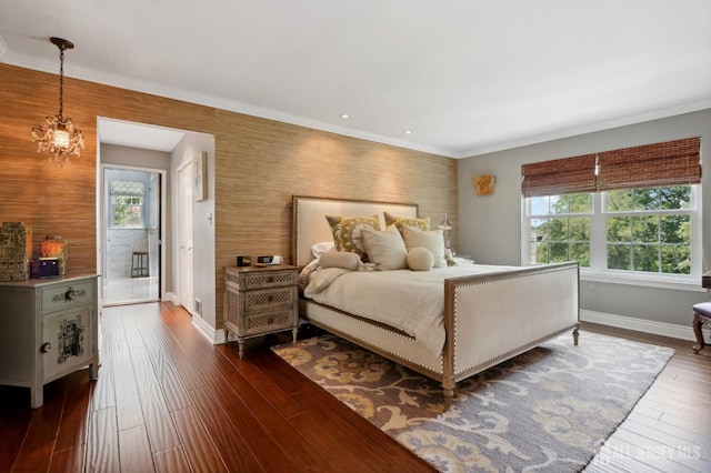 bedroom with a notable chandelier, dark hardwood / wood-style floors, crown molding, and multiple windows