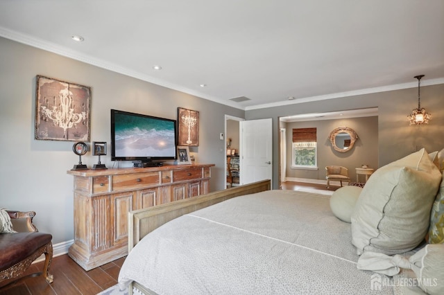 bedroom with dark hardwood / wood-style floors and ornamental molding