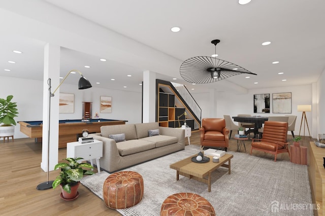 living room with light hardwood / wood-style flooring and pool table