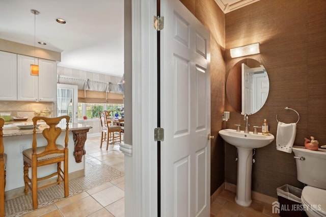 bathroom with sink, tile patterned flooring, and toilet