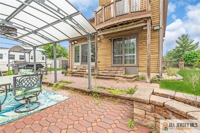 10 Signal Ct, South Brunswick, NJ 08810 - view of patio with entry steps, a pergola, a storage unit, an outbuilding, and outdoor dining space
