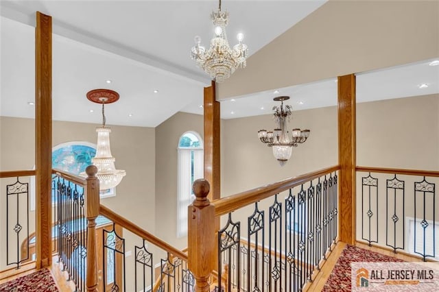 10 Signal Ct, South Brunswick, NJ 08810 - corridor featuring a chandelier, an upstairs landing, vaulted ceiling, wood finished floors, and recessed lighting