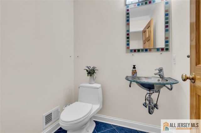 10 Signal Ct, South Brunswick, NJ 08810 - half bath with tile patterned floors, toilet, and baseboards
