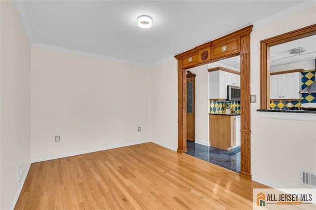 10 Signal Ct, South Brunswick, NJ 08810 - unfurnished room with wood finished floors, crown molding, and baseboards