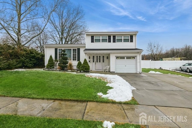 view of front of house featuring an attached garage, fence, concrete driveway, and a front yard