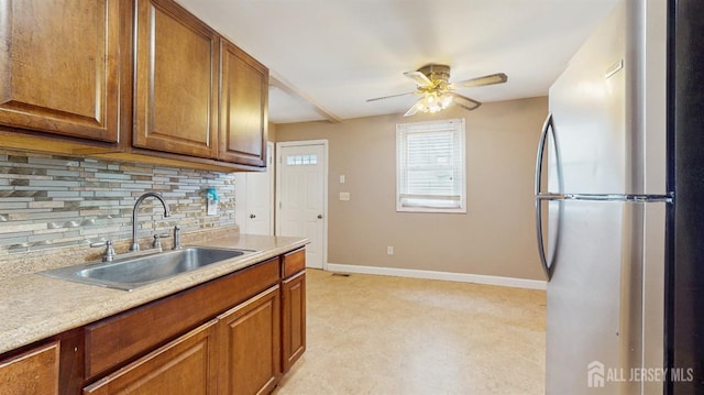811 Shore Concourse, Keyport, NJ 07735 - kitchen featuring freestanding refrigerator, a sink, backsplash, baseboards, and light countertops