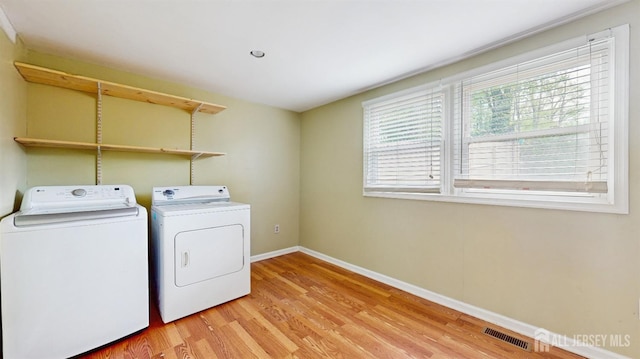 811 Shore Concourse, Keyport, NJ 07735 - laundry area with washer and dryer, light wood-type flooring, and baseboards