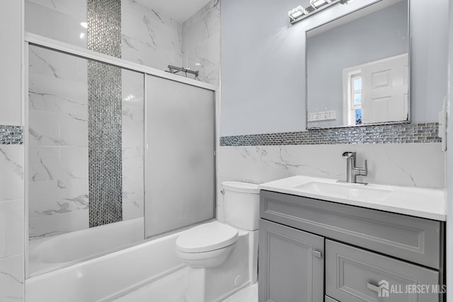 34 Sims Rd, Edison, NJ 08817 - bathroom featuring vanity, tile walls, and bath / shower combo with glass door