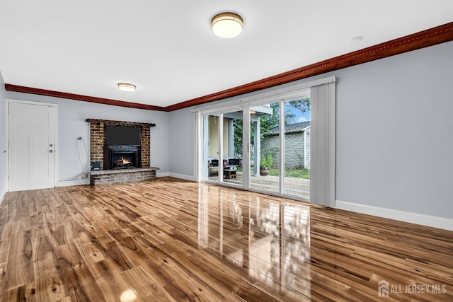 34 Sims Rd, Edison, NJ 08817 - unfurnished living room featuring wood finished floors, crown molding, and a brick fireplace