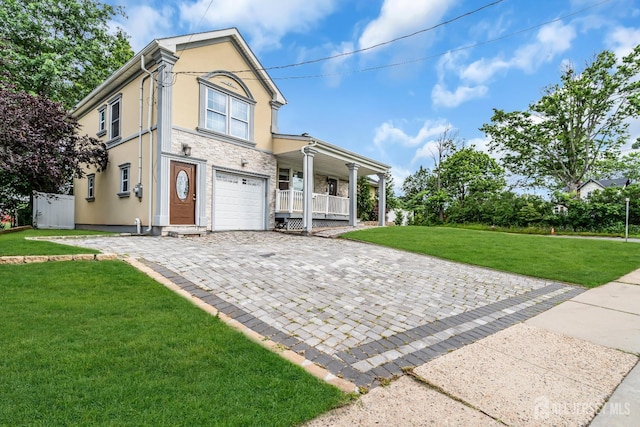 34 Sims Rd, Edison, NJ 08817 - view of front facade featuring covered porch, stucco siding, stone siding, a front yard, and decorative driveway