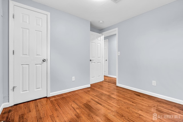 34 Sims Rd, Edison, NJ 08817 - unfurnished bedroom featuring baseboards and wood finished floors