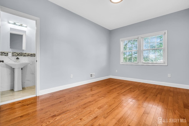 34 Sims Rd, Edison, NJ 08817 - unfurnished bedroom featuring light wood-type flooring and baseboards