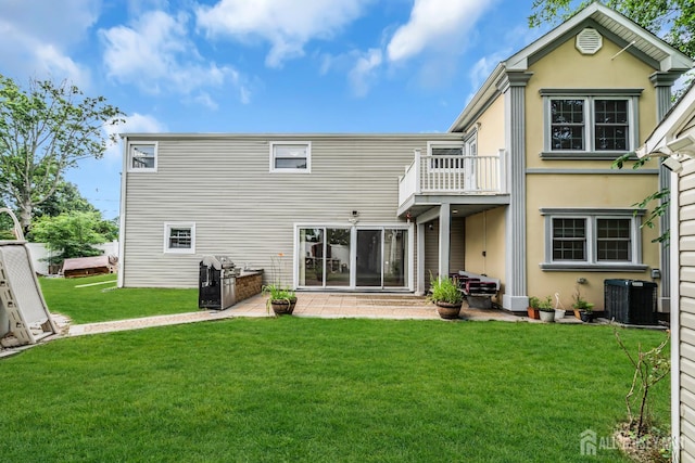 34 Sims Rd, Edison, NJ 08817 - rear view of property featuring a balcony, a lawn, stucco siding, and a patio area