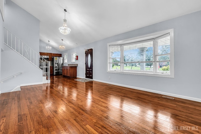 34 Sims Rd, Edison, NJ 08817 - unfurnished living room with a chandelier, dark wood-type flooring, stairway, and lofted ceiling