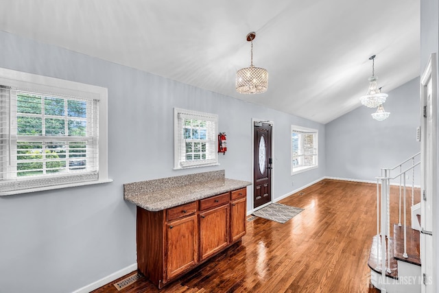 34 Sims Rd, Edison, NJ 08817 - kitchen with a chandelier, brown cabinetry, dark wood-type flooring, lofted ceiling, and decorative light fixtures