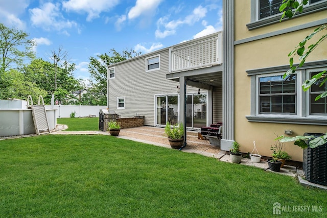 34 Sims Rd, Edison, NJ 08817 - back of property with a balcony, a patio, and stucco siding